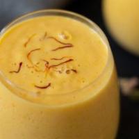 Mango Lasi · A refreshment of yogurt sugar and mango puree.