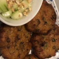Corn Patties · Crispy fried corn, green beans, and flour served with cucumber sauce.
