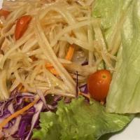 Som Tom Salad · Shredded green papaya and carrot with Thai pepper, peanuts, lime juice and tomatoes. Thai sp...