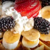 Protein Waffles · Dulce de leche and vanilla protein, strawberries, banana and blueberries. Caramel/chocolate/...