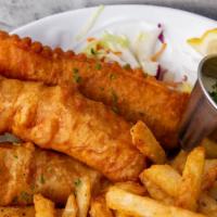 Fish & Chips · Premium cod fish, hand-dipped in our house batter served with lemon wedges and tartar sauce.