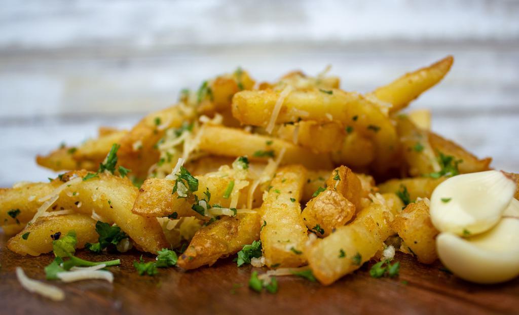 Garlic Fries Galore · Sea salt fries tossed in butter, garlic, parsley, and Parmesan.