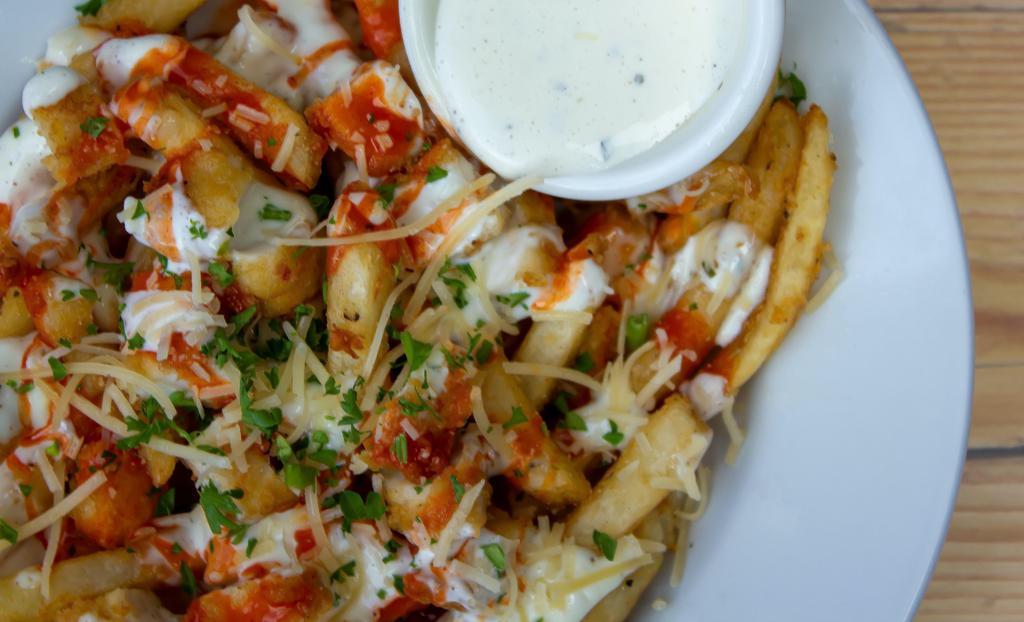Loaded Fries · Topped with chicken, Jack cheese, bleu cheese, ranch, and buffalo sauce.