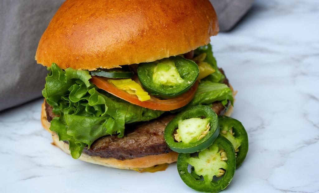 Blazing Jalapeño Burger · 1/3 lb. beef patty, fresh jalapeños, Jack cheese, avocado, lettuce, tomato, and flame's sauce. Served on a brioche bun ( double up your patty for an additional charge).