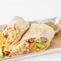 Combo Breakfast Burrito · Flour tortilla with scrambled eggs, bacon, sausage, grilled bell peppers, grilled onions, ha...