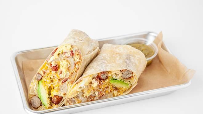 Combo Breakfast Burrito · Flour tortilla with scrambled eggs, bacon, sausage, grilled bell peppers, grilled onions, hash browns and cheddar cheese!