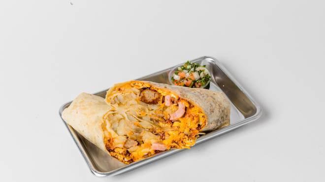 Carnivore Breakfast Burrito · Flour tortilla with scrambled eggs, bacon, sausage, ham, hash browns and cheddar cheese!