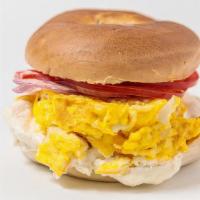Breakfast Bagel · Fresh toasted bagel with scrambled eggs, cheddar cheese and your choice of either bacon or t...
