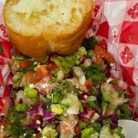 Chopped Salad · A Chicago classic salad with greens, bac’n, chick’n, pasta, tomatoes and green onions all ch...