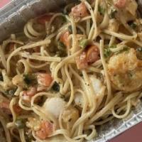 Cajun Seafood Linguine · Shrimp and scallops sauteed in a creamy Cajun sauce with tomatoes, basil and green onions.