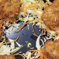 Coconut Shrimp · Lightly battered shrimp coated with coconut flakes