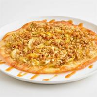 Apple Crisp Dessert Pizza · A dessert made entirely from scratch, featuring our handmade thin crust topped with brown su...