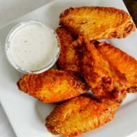 Buffalo Wings · Buffalo wings come with a side of buffalo sauce for dipping
Honey BBQ wings come with a side...