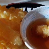 Shrimp Tempura · Fresh shrimp dipped in tempura batter and deep-fried until perfectly crispy. Served with tem...