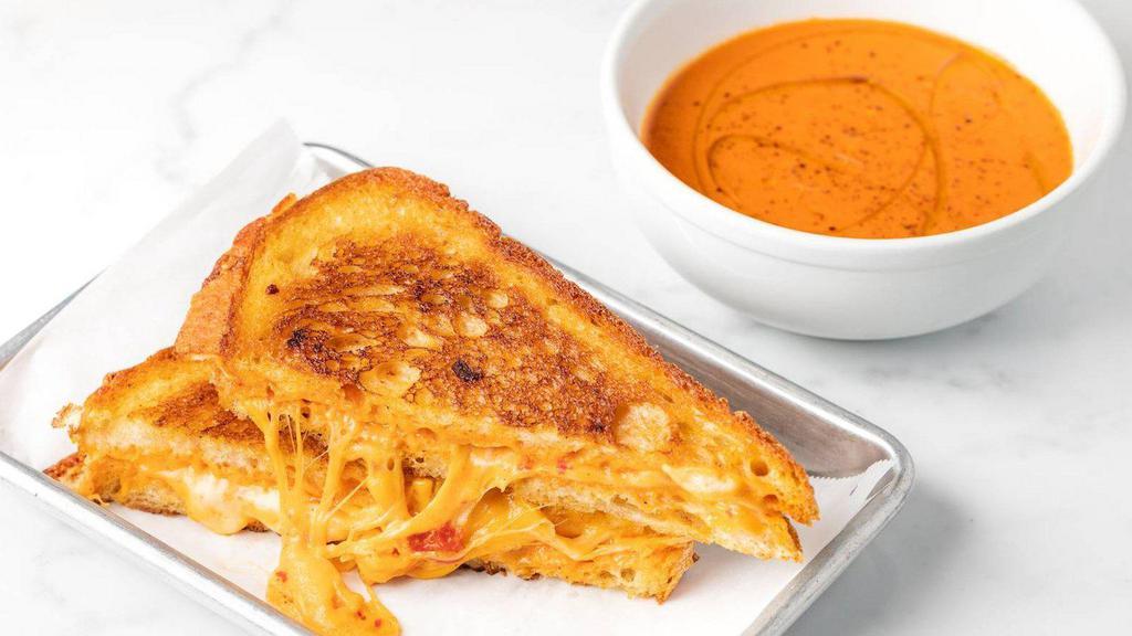 Grilled Cheese & Tomato Soup · (v) Grilled Cheese and Tomato Soup -  Cheddar, Provolone and Pimento Cheese on Griddled Sourdough Bread served with House Made Tomato Soup $16.00