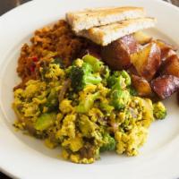 The All American Vegan · Tofu veggie scramble with tempeh sausage, roasted potatoes and olive toast.