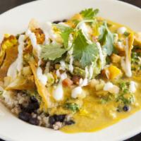 Chilaquiles · Organic corn tortilla chips, tofu egg scramble, black beans, rice, kale & housemade salsa ve...