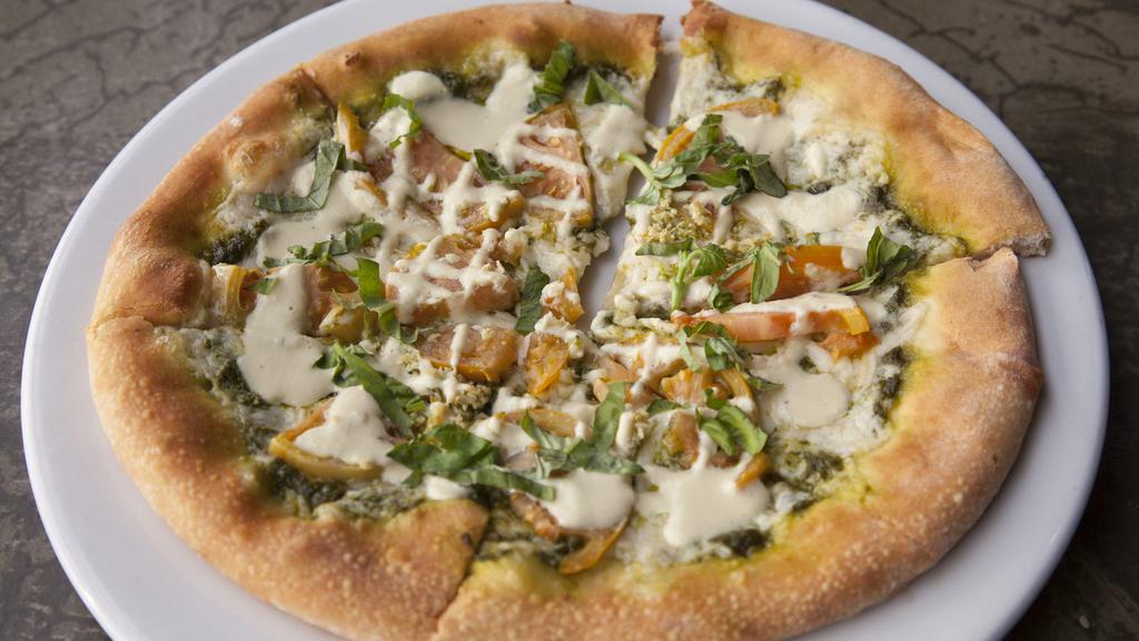 Heirloom Tomato & Garlic · Hemp seed pesto & Mozzarella topped with heirloom tomatoes & chopped garlic, drizzled with cashew alfredo & topped with fresh chopped basil.
