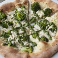 White Pizza · House-made pesto, Mozzarella topped with tempeh sausage, peppers & onions.