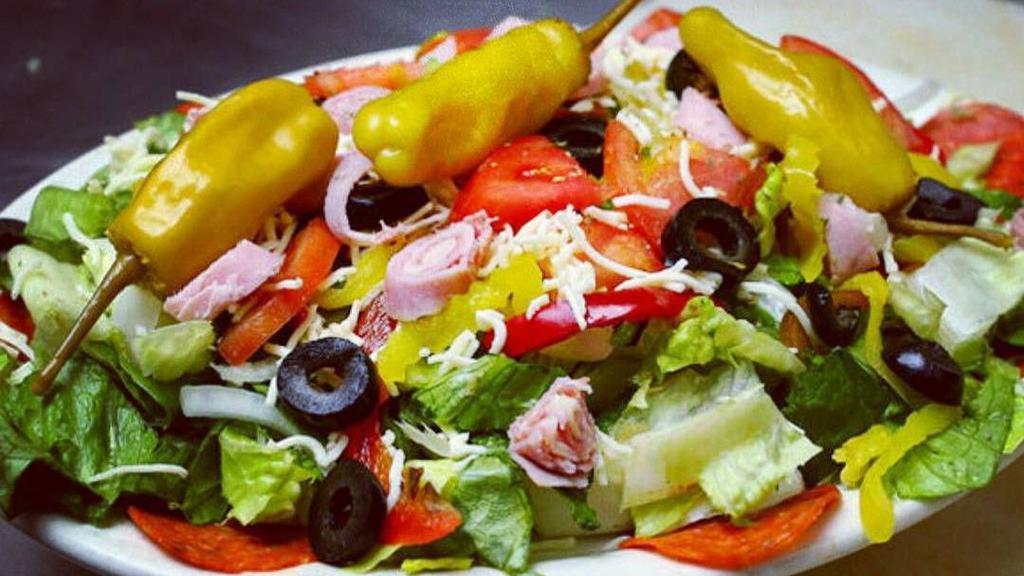Greek Salad · Romaine lettuce, tomato, feta cheese, bell peppers, cucumber, Kalamata olive, onion and balsamic vinaigrette.