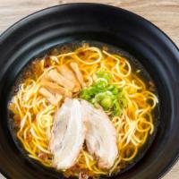 Shoyu Ramen · Soy based ramen with hick noodles and 2 slices of chashu, garnished with bamboo shoots and g...