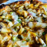 Teriyaki Pizza · Herb Oil, Mozzarella, Chicken, Red Onions, Green Onions, Pineapples with a drizzle of Teriya...