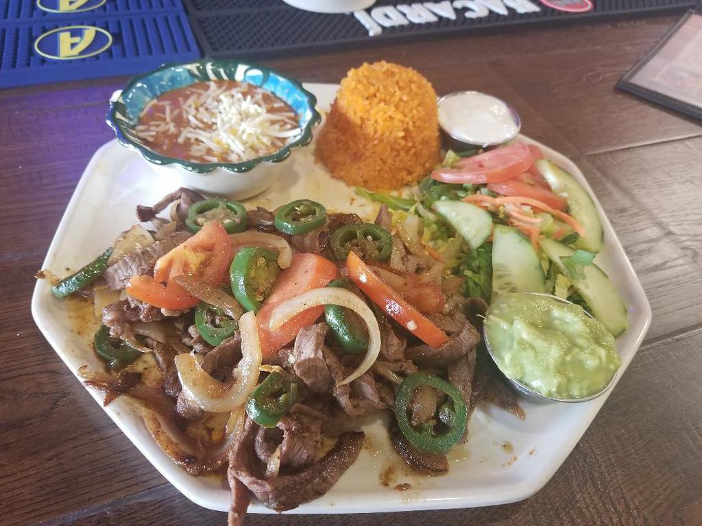 Steak Ranchero · Stripes of tri tip sauteed with jalapenos, onions and tomatoes.