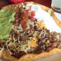 Taco Salad · Rice, beans, cheese, choice of meat, lettuce, guacamole, sour cream and pico de gallo, all s...