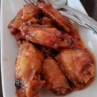 Spicy Angel Wings · Deep-fried chicken wings in a sweet chili sauce.