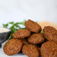 Falafel (6 Pc.)  · 6 pieces of deep-fried patties made from ground chickpeas, garlic, onions, cilantro and spic...