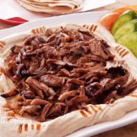 Hummus Shawarma · SERVED WITH PITA. Hummus topped with Beef Shawarma meat.