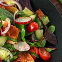 Fatoush · Fatoush is a Mediterranean salad that includes lettuce, tomatoes, cucumbers, onions, and fri...