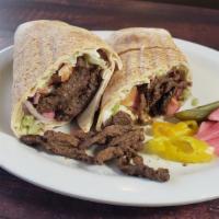 Beef Shawarma Wrap · Thinly sliced Beef Shawarma wrapped in Pita bread with lettuce, tomatoes, onions, parsley, s...