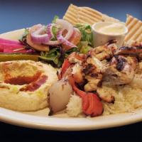 Chicken Kabab Plate · 2 skewers of grilled marinated chicken cubes served with rice, hummus, salad, garlic sauce, ...