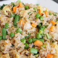 Vegetable Fried Rice · Fried rice with Broccoli, Zucchini, Green Onions, and Peas&Carrot.