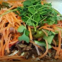 Banh Mi · Pork, kale slaw, carrots, pickled veggies, cucumber, cilantro, jalapeño, sweet chili, srirac...