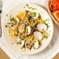 Spaghetti With Clam Sauce · Our special clam sauce (red or clear) prepared with sautéed onions, tender baby clams and fr...