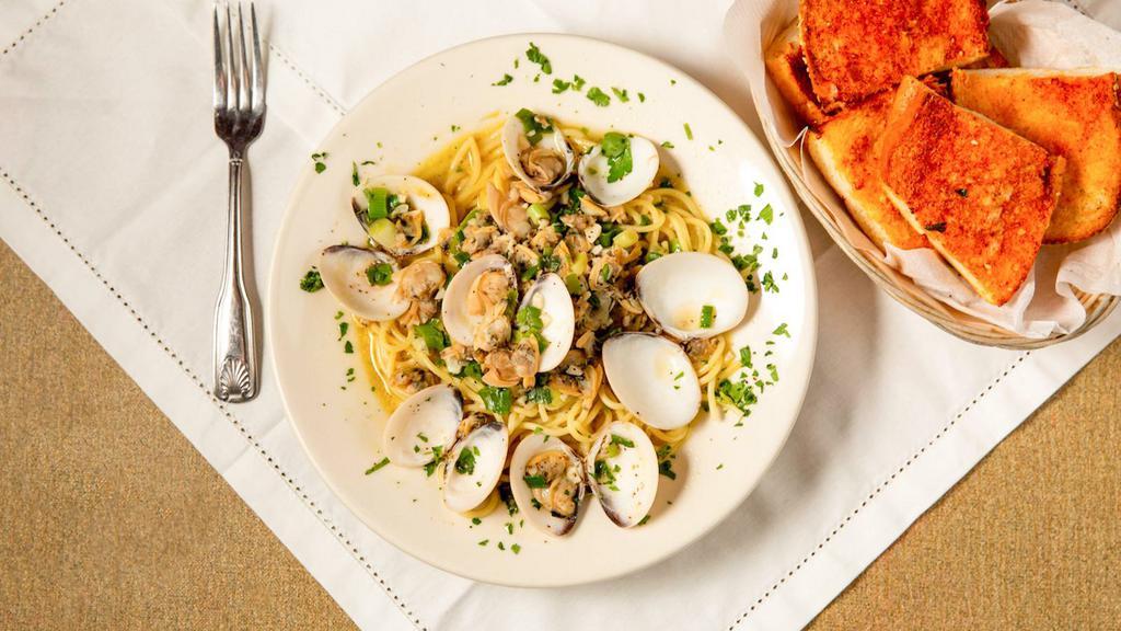 Spaghetti With Clam Sauce · Our special clam sauce (red or clear) prepared with sautéed onions, tender baby clams and fresh parsley.  SERVED WITH GARLIC BREAD AND YOUR CHOICE OF HOMEMADE MINESTRONE SOUP OR A HOUSE SALAD.