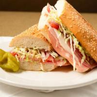 Famous Torpedo · Comes with salami, ham, mortadella, provolone, lettuce, tomatoes, onions and italian dressing.