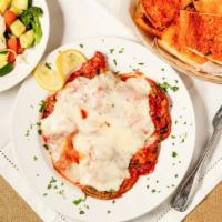 Eggplant Parmigiana · Slices of eggplant, topped with marinara sauce and mozzarella cheese. served with GARLIC BRE...