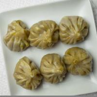 Vegetable Momo · 6 pieces per order. Steamed mixed vegetable dumplings, served with tomato chutney.