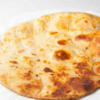 Alu Paratha · Whole wheat flat bread, dry cooked potatoes and ghee (clarified butter).