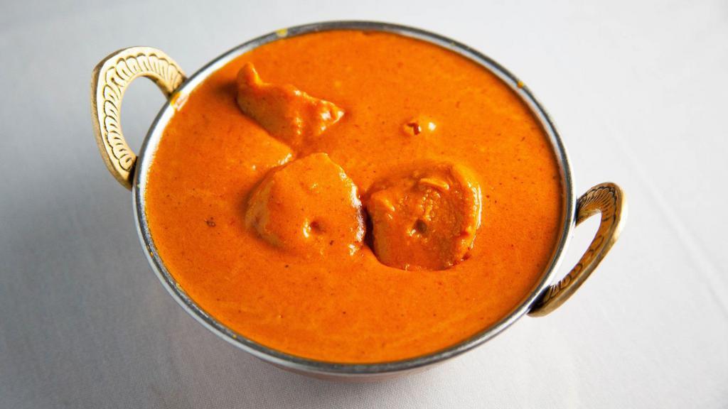 Chicken Tikka Masala · Charcoal roasted boneless chicken cubes cooked with herbs and spices in a special creamy sauce.