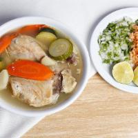 Chicken Soup (Caldo De Pollo) · Chicken and vegetables. Rice, onions, cilantro, lime, and tortillas on the side.