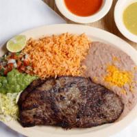 Carne Asada Plate · Two steaks. Rice, beans, lettuce, pico de gallo, and guacamole.