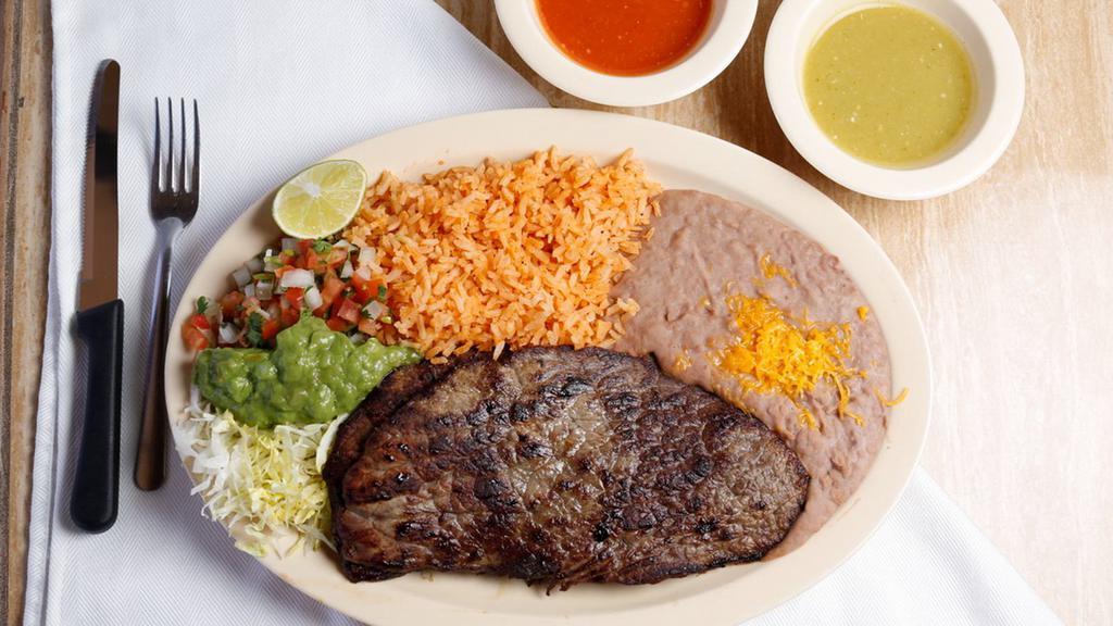 Carne Asada Plate · Two steaks. Rice, beans, lettuce, pico de gallo, and guacamole.