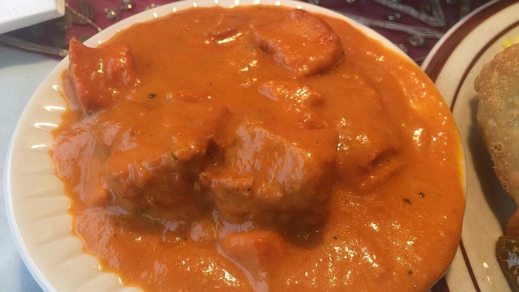 Tikka Masala · Chunks of chicken breast marinated in yogurt & spices, served in a masala sauce.