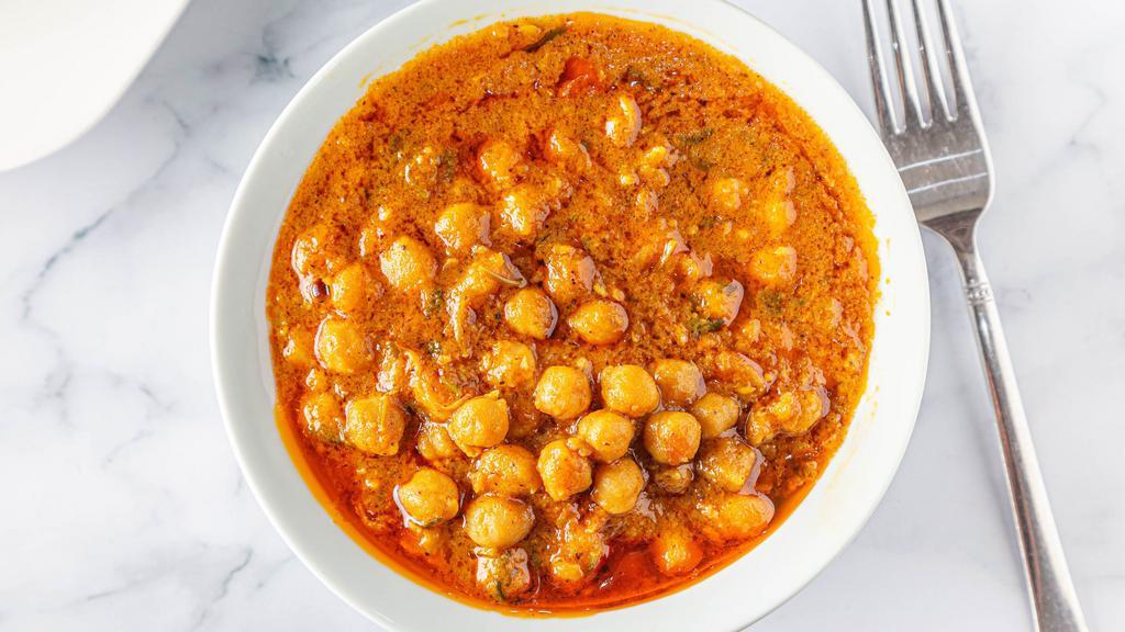 Chana Masala · Chickpeas spiced with tomatoes and onions.