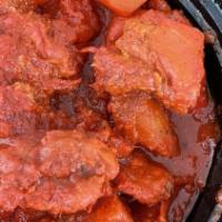 Chicken Vindaloo · Chunks of chicken cooked in a special hot sauce.