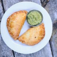 Grass-Fed Beef Empanada · Fresh, grass-fed ground beef, potatoes, onions, garlic and spices. We recommend our fresh ho...